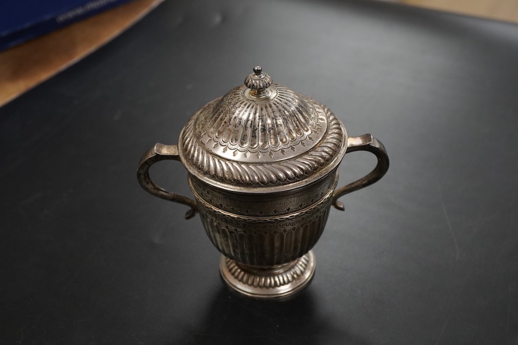 A George V silver twin handled loving cup and cover in early 18th century style height 11cm. , weight approx. 6.56ozt